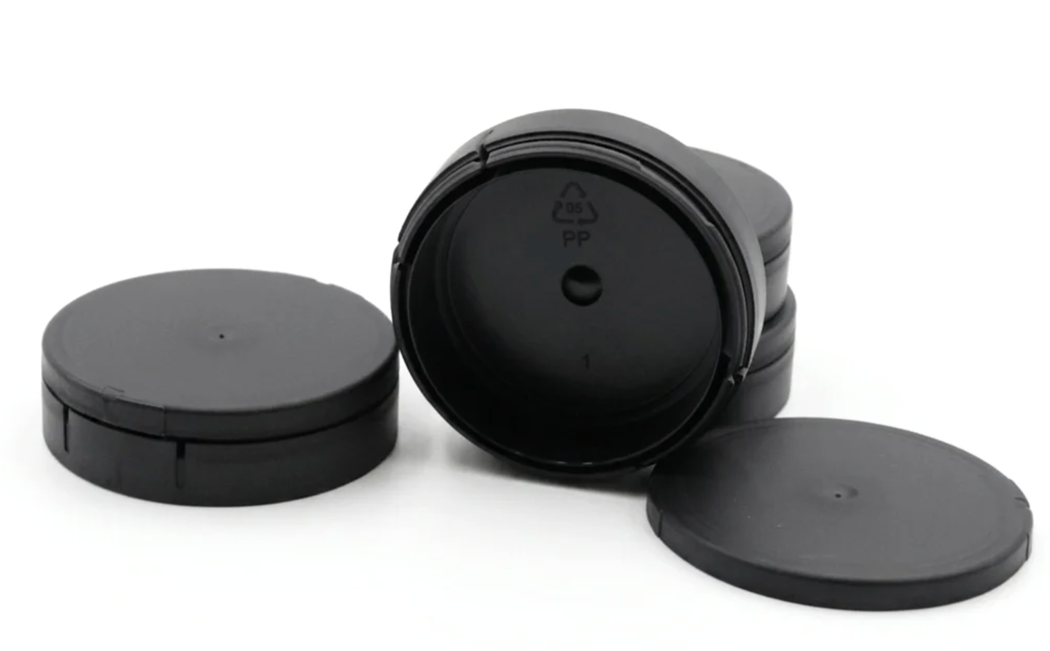 Empty Snus Cans Wholesale OEM Nicotine Pouch black cans stacked with lids showing PP food-grade material marking