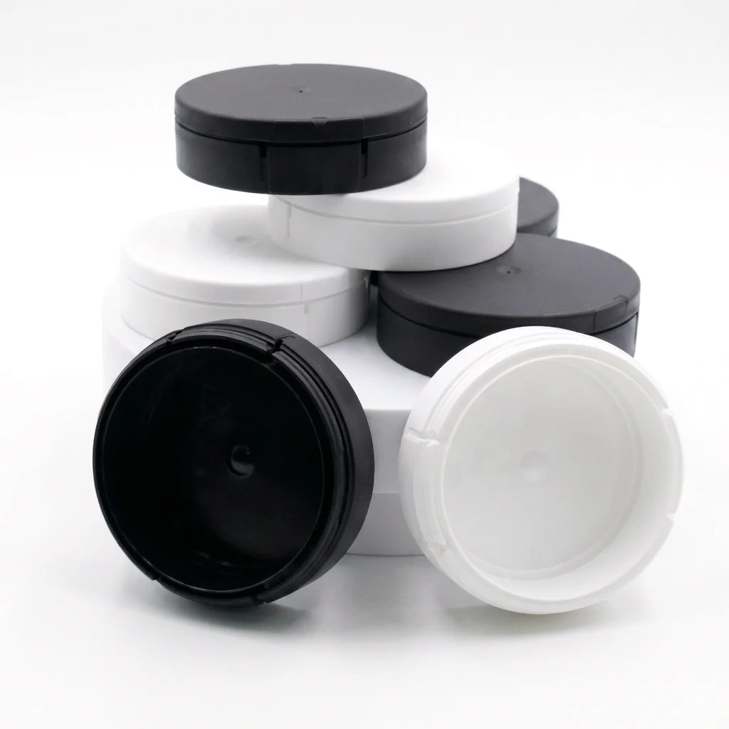 MANKE child-resistant snus cans shown open and stacked for sample evaluation