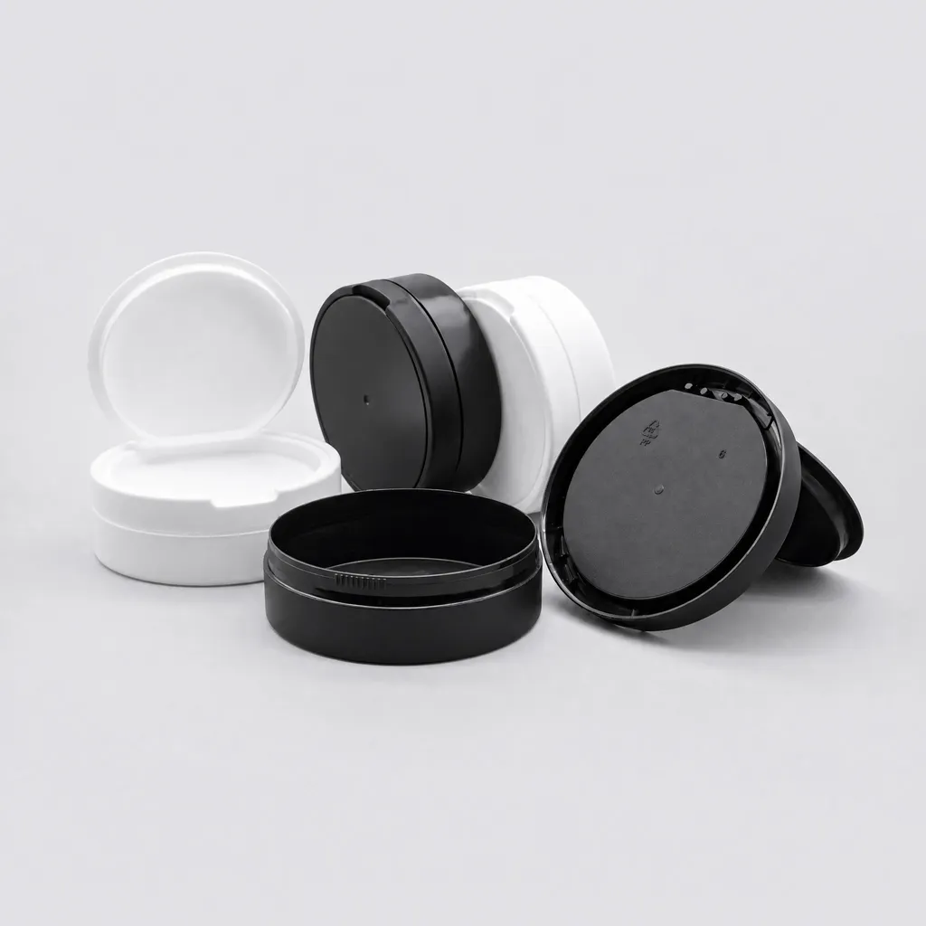 Standard flip-top snus cans in black and white PP, open and closed cans together