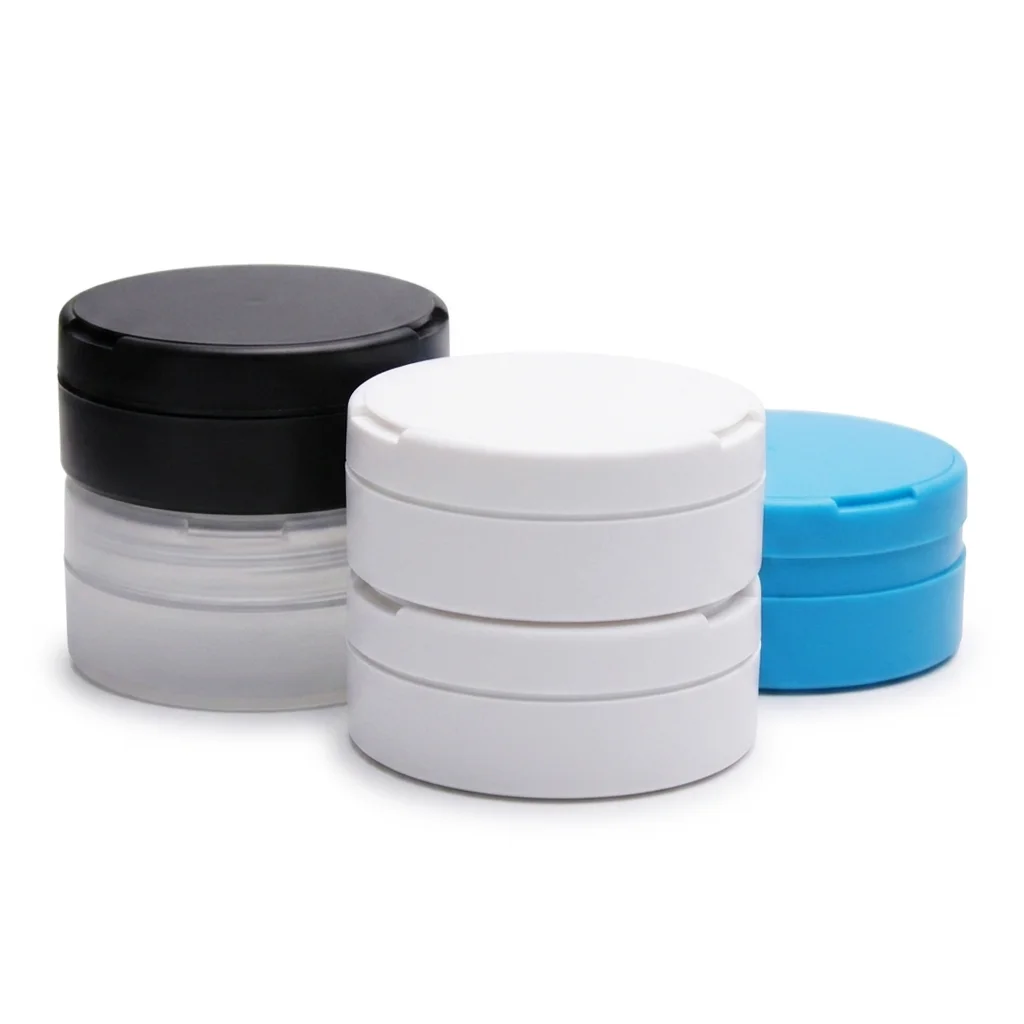 Custom plastic snus cans in black, white, and blue finishes