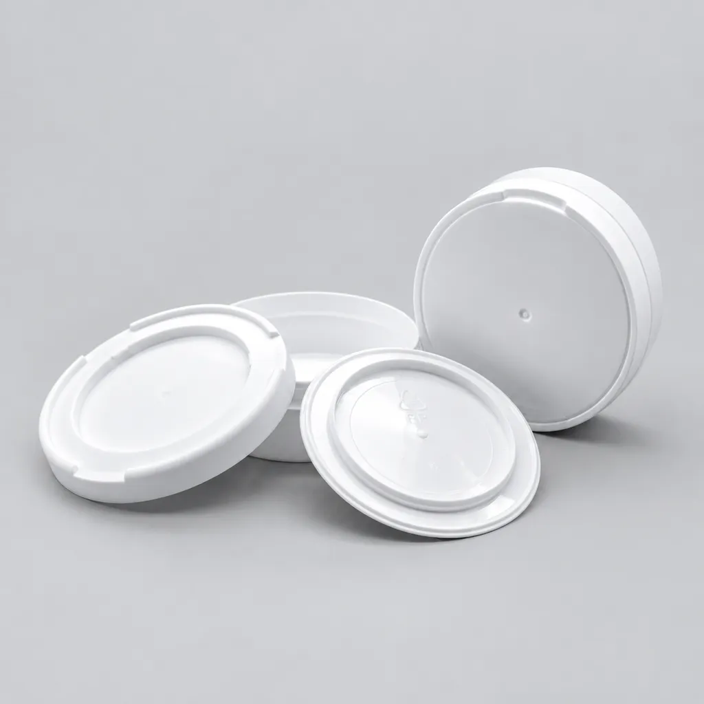 White snap-on lids and snus can bases grouped on a gray background